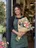 A florist in her shop doorway.