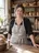 A bakery owner at her counter.