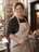 A bakery owner at her oven.