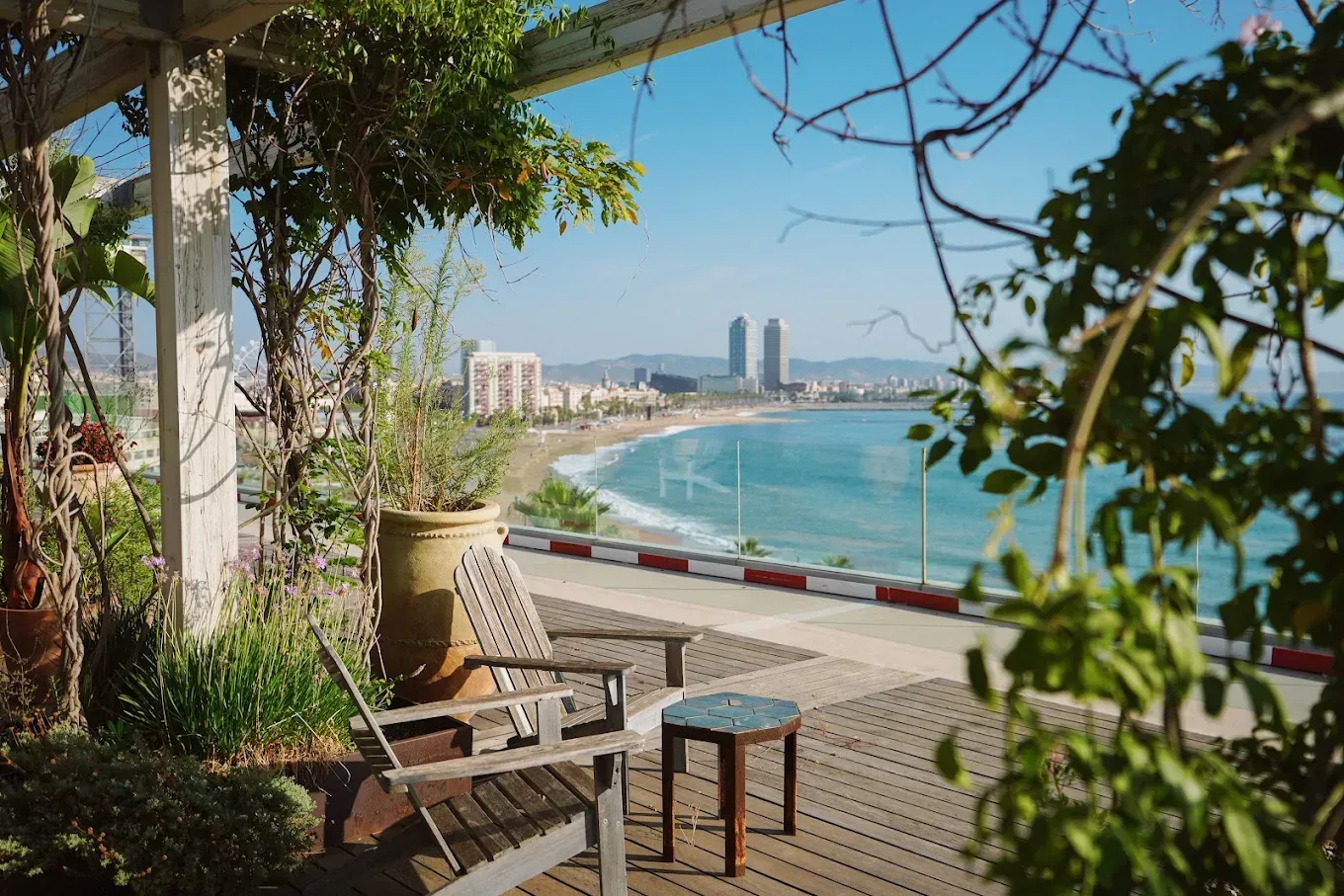 The rooftop terrace at Norrsken House, looking down the Barcelona beach